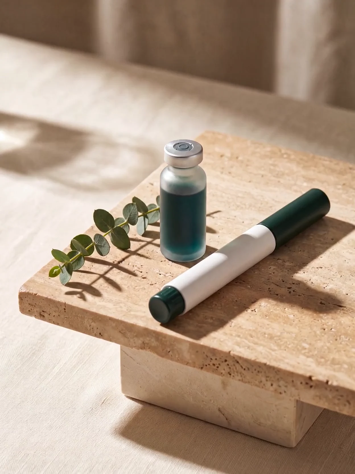 Compounded GLP-1 medication: a single-dose vial and an auto-injector pen in soft studio light
